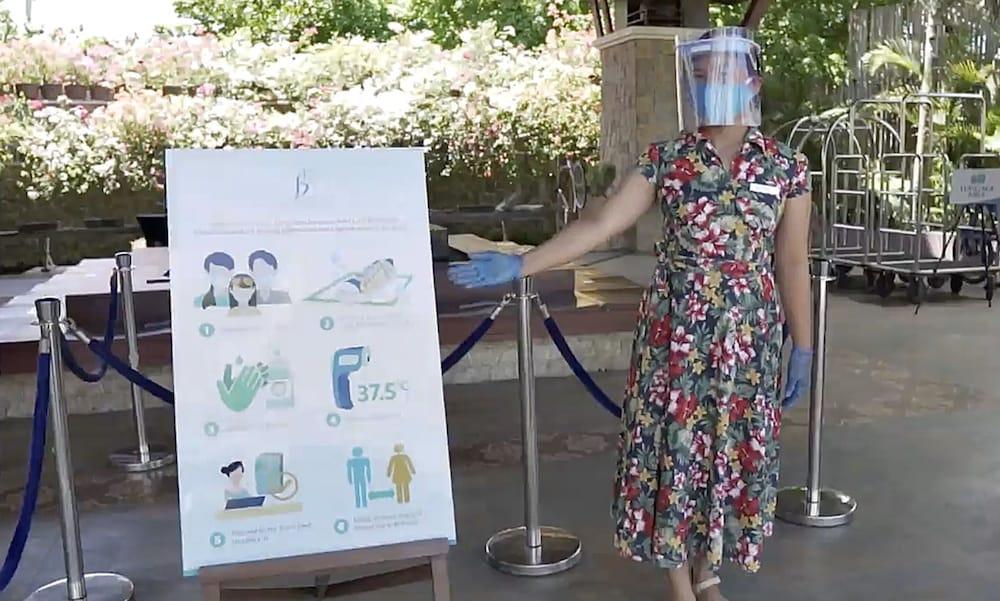 The Bellevue Resort Панглао Экстерьер фото A woman wearing a face shield at the entrance of a hotel in Paris, France
